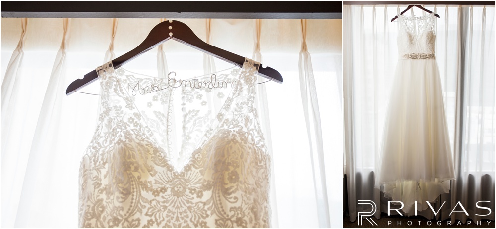 Rustic Outdoor Fall Wedding | Two pictures of a bride's lacy gown hanging in the window of the Kansas City Crowne-Plaza. 