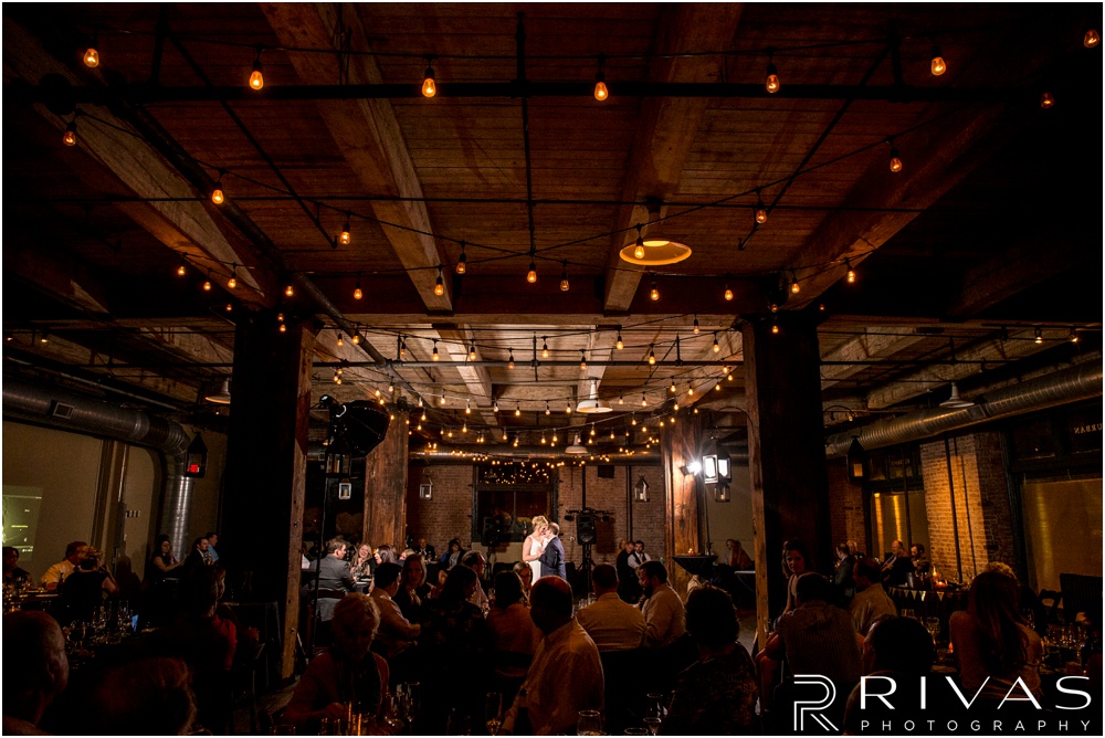 Rustic Outdoor Fall Wedding | A picture of the entire room watching a bride and groom share their first dance at Feasts of Fancy. 