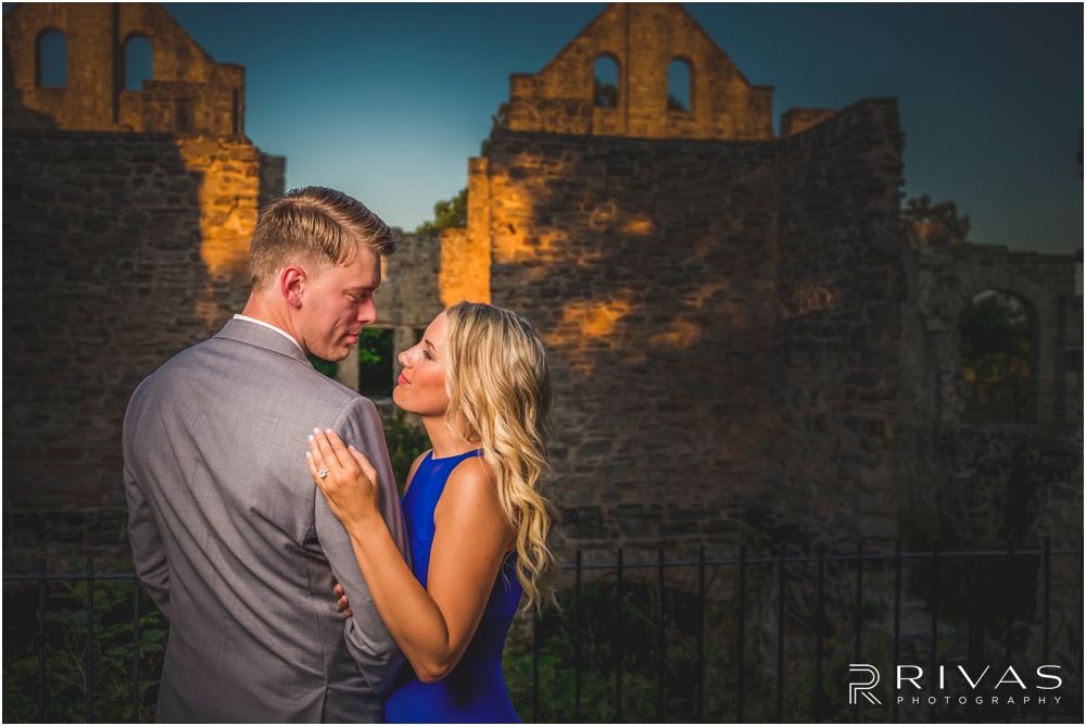 romantic castle ruins engagement pictures | A close-up picture of an engaged couple embracing outside castle ruins. 