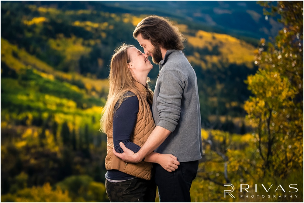 Fall Aspen Engagement Session | A photo of an engaged couple hugging on a boulder at a roadside park outside Aspen, Colorado. 
