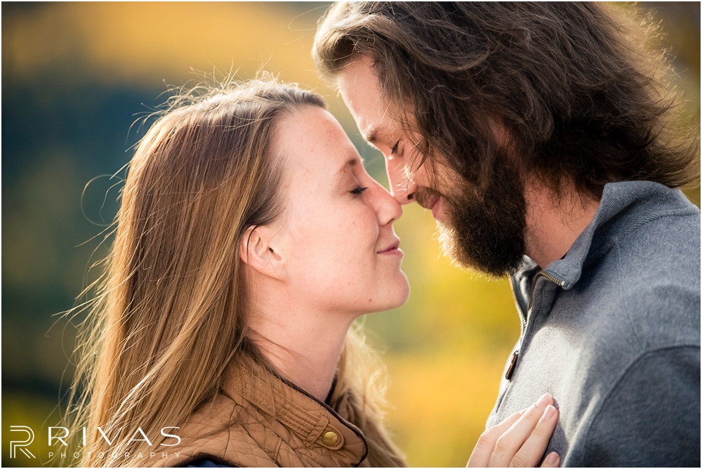 Fall Aspen Engagement Session | A close-up picture of an engaged couple hugging on a boulder at a roadside park outside Aspen, Colorado. 