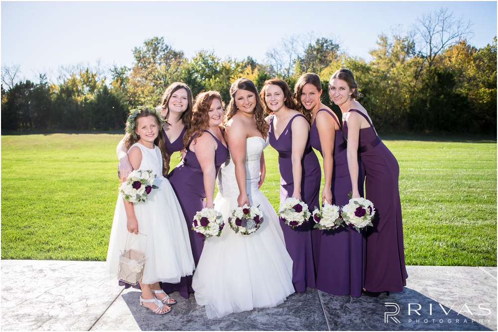 elegant fall wedding buffalo lodge | A picture of a bride and her bridesmaids on the patio of The Buffalo Lodge. 