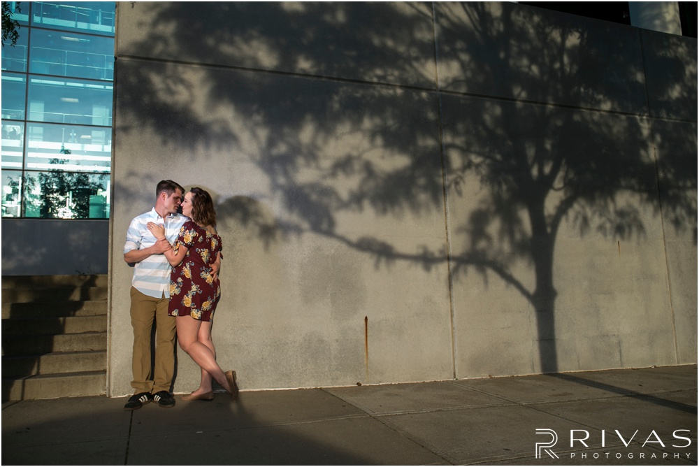 Summertime Crossroads Engagement Session | Picture of an engaged couple on the west side of the Kansas City Star Building. 