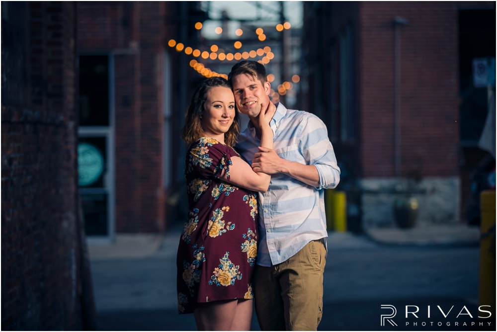 Summertime Crossroads Engagement Session | Picture of an engaged couple in a brick alleyway of Kansas City's Crossroads District.  