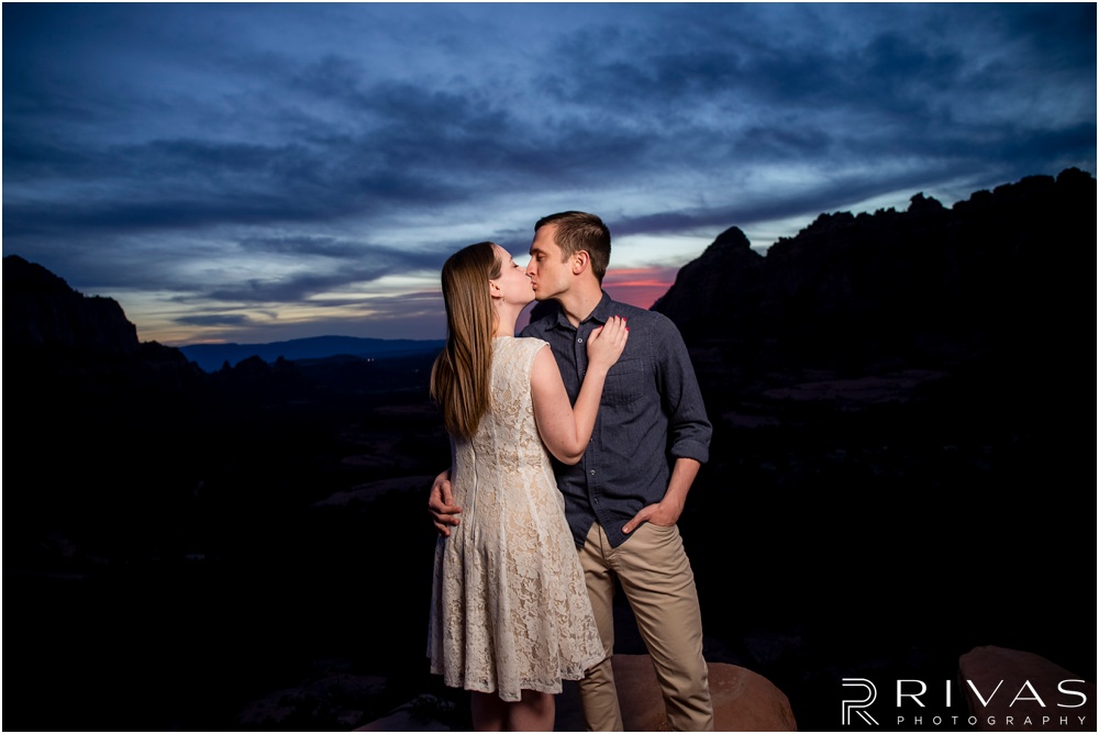 Merry-Go-Round Rock Engagement Session | Close-up photo of an engaged couple standing on Merry-Go-Round Rock at sunset in Sedona.  