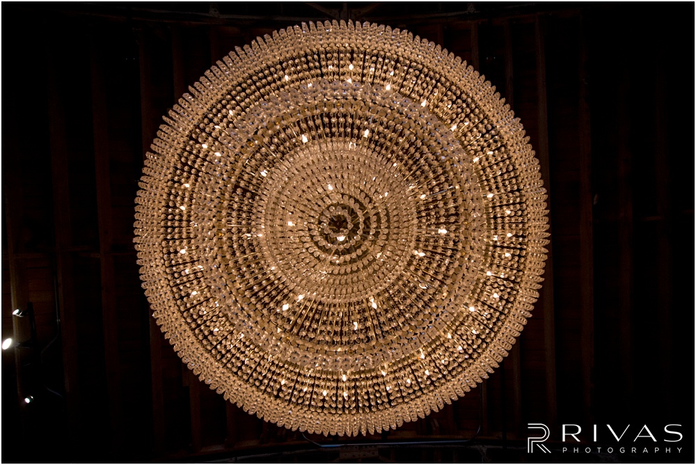 Vibrant Spring Wedding at The Guild | A symmetrical photo of The Guild KC's chandelier shot from below. 