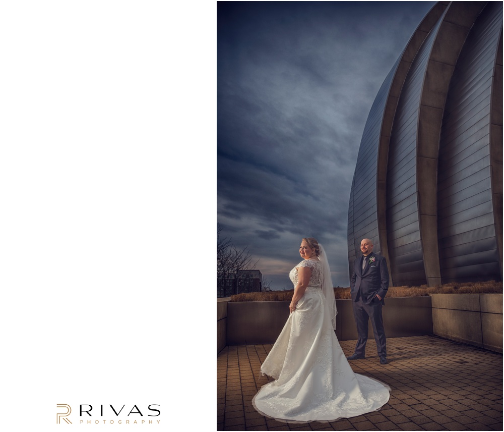 Vibrant Spring Wedding at The Guild | A picture of a bride and groom standing in front of The Kauffman Center for Performing Arts in Kansas City. 
