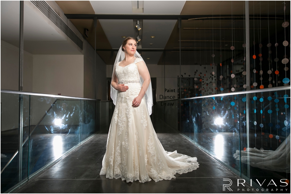 St. John the Evangelist Catholic Church Spring Wedding | A formal portrait of a bride in her wedding gown at the Lawrence Arts Center. 