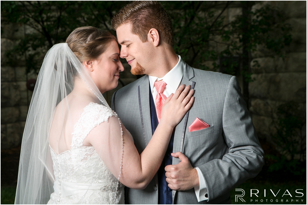 St. John the Evangelist Catholic Church Spring Wedding | A close-up image of a bride and groom embracing outside the courthouse in Lawrence, KS on their wedding day. 