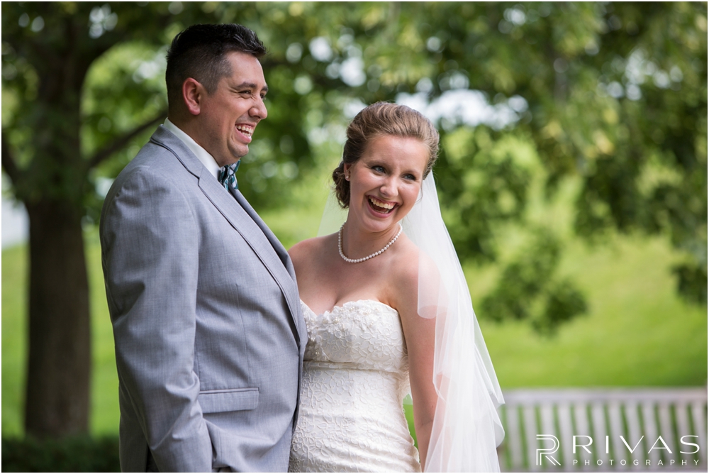 Classic Summer Wedding at Berg Event Space | A candid image of a bride and groom embracing on their wedding day in the gardens at The Nelson Atkins Museum of Art in Kansas City. 