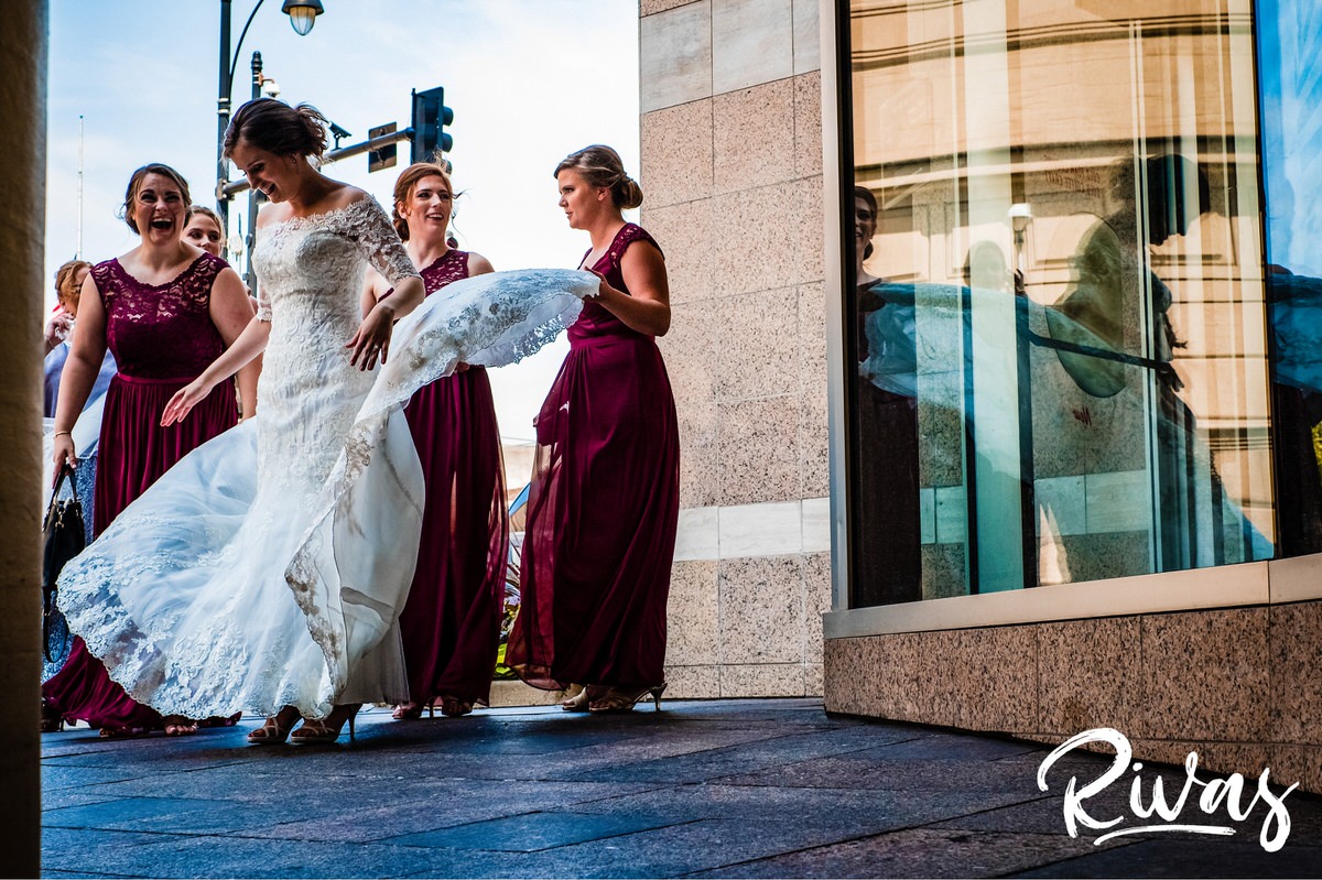 8 Things Your Wedding Photographer Wants you to Know | A photo of a bride's train getting blown up in the wind on her wedding day in downtown Kansas City. 