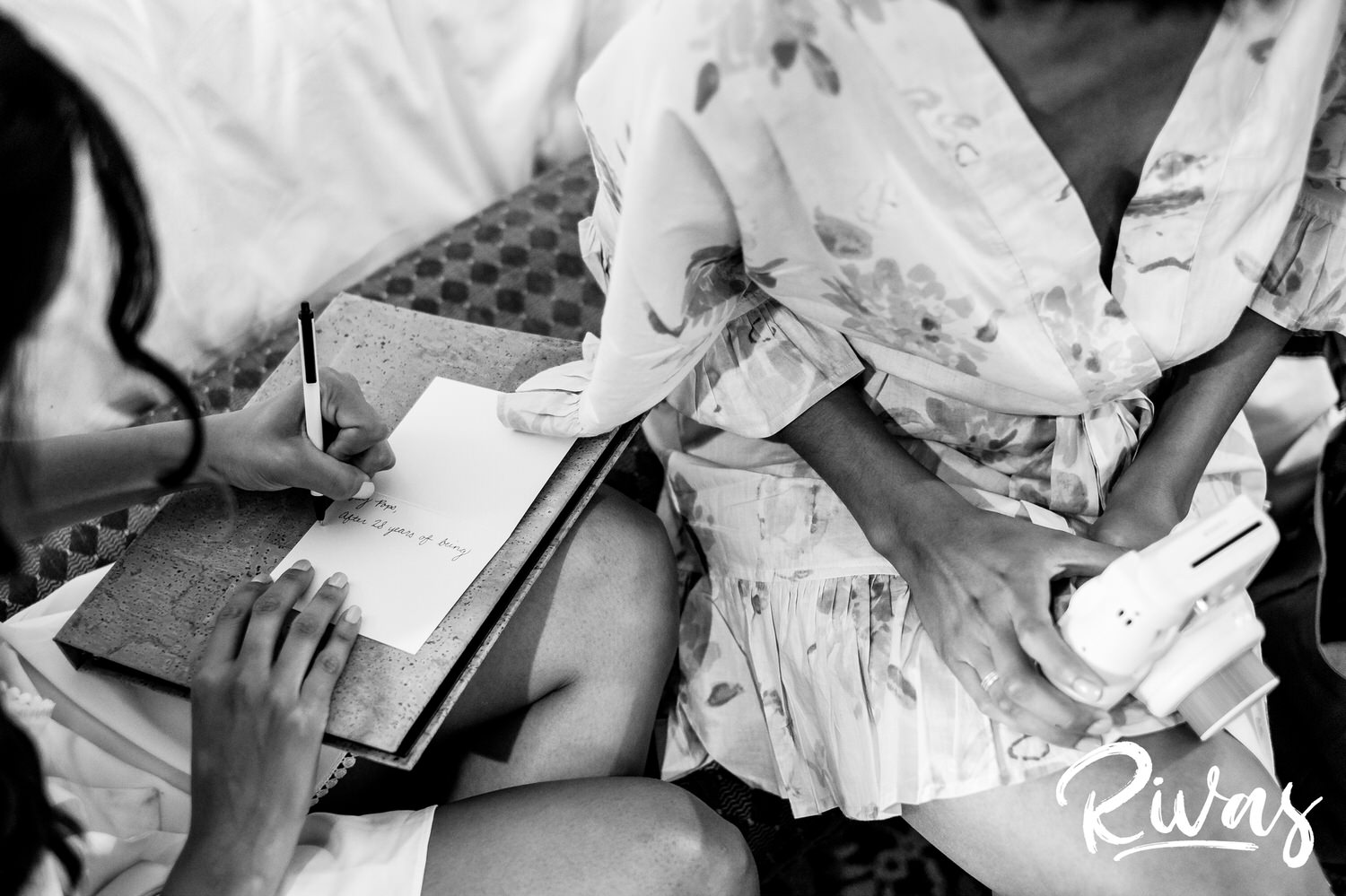 Saddlerock Ranch Summer Wedding | Destination Wedding Photographers | Rivas | A candid black and white portrait of a bride writing a note to her groom on the morning of her wedding at Malibu's Saddlerock Ranch. 