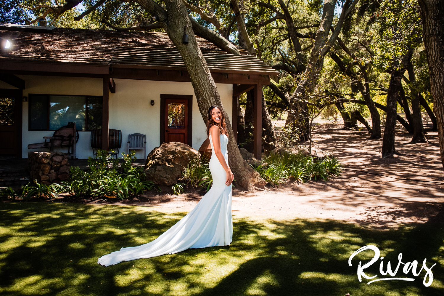 Saddlerock Ranch Summer Wedding | Destination Wedding Photographers | Rivas | A vibrant portrait of a bride laughing and looking over her right shoulder on the morning of her wedding. 