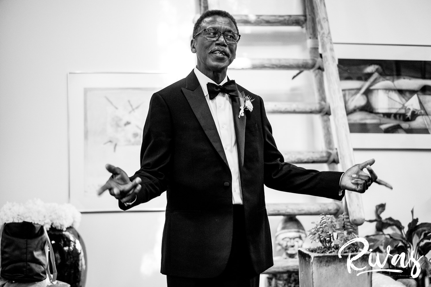 Saddlerock Ranch Summer Wedding | Destination Wedding Photographers | Rivas | A candid black and white image of the bride's father gesturing that it's time to get married. 