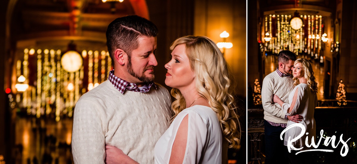 KC Winter Lights Engagement Pictures | Kansas City engagement Pictures | Rivas | Two picture of an engaged couple sharing an embrace and smiling at each other as they stand on the balcony of Kansas City's Union Station, with the twinkly lights of the grand hall visible behind them during their winter engagement session. 