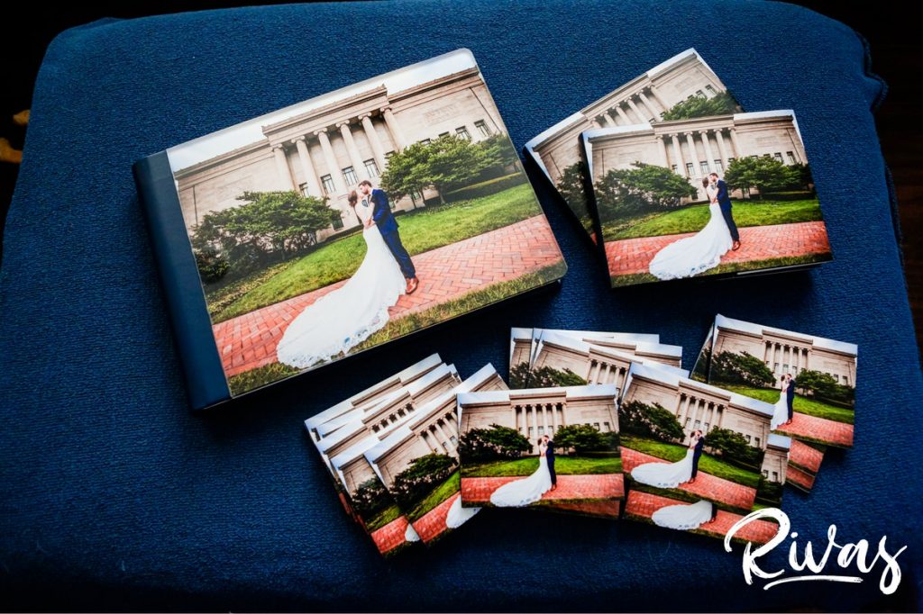 Maroon & Navy Custom Wedding Album | A staged photo of a custom wedding album on a blue background with matching parent and wedding party books.  