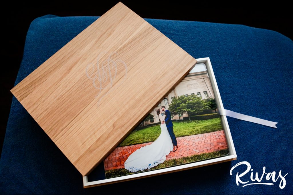 Maroon & Navy Custom Wedding Album | A staged picture of the crystal glance cover of a custom wedding album and the upper inside of the album box. 