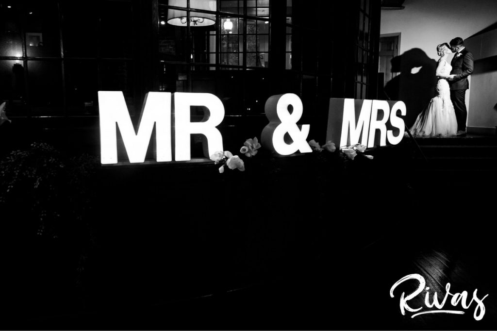 Art Deco Inspired Wedding in Kansas City | A black and white portrait with the words "Mr & Mrs" lit up in lights 