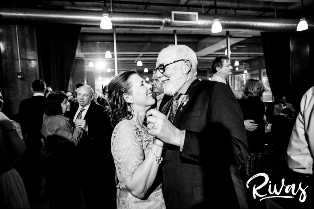 Downtown KC Library Wedding - Rivas Photography | A close-up picture of a bride's parents laughing with each other as they share a dance during their daughter's Boulevard Brewing Company wedding reception. 