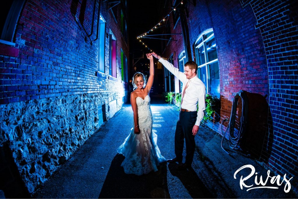 Tips for a Smooth Wedding Day | Kansas City Wedding Photographers | A dramatic image of a bride and groom dancing in the alley outside The Bride and the Bauer in Kansas City's Crossroads District on the night of their wedding.