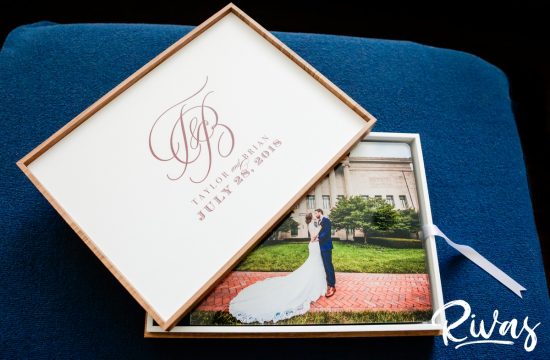 Maroon & Navy Custom Wedding Album | A staged picture of the crystal glance cover of a custom wedding album and the upper inside of the album box.