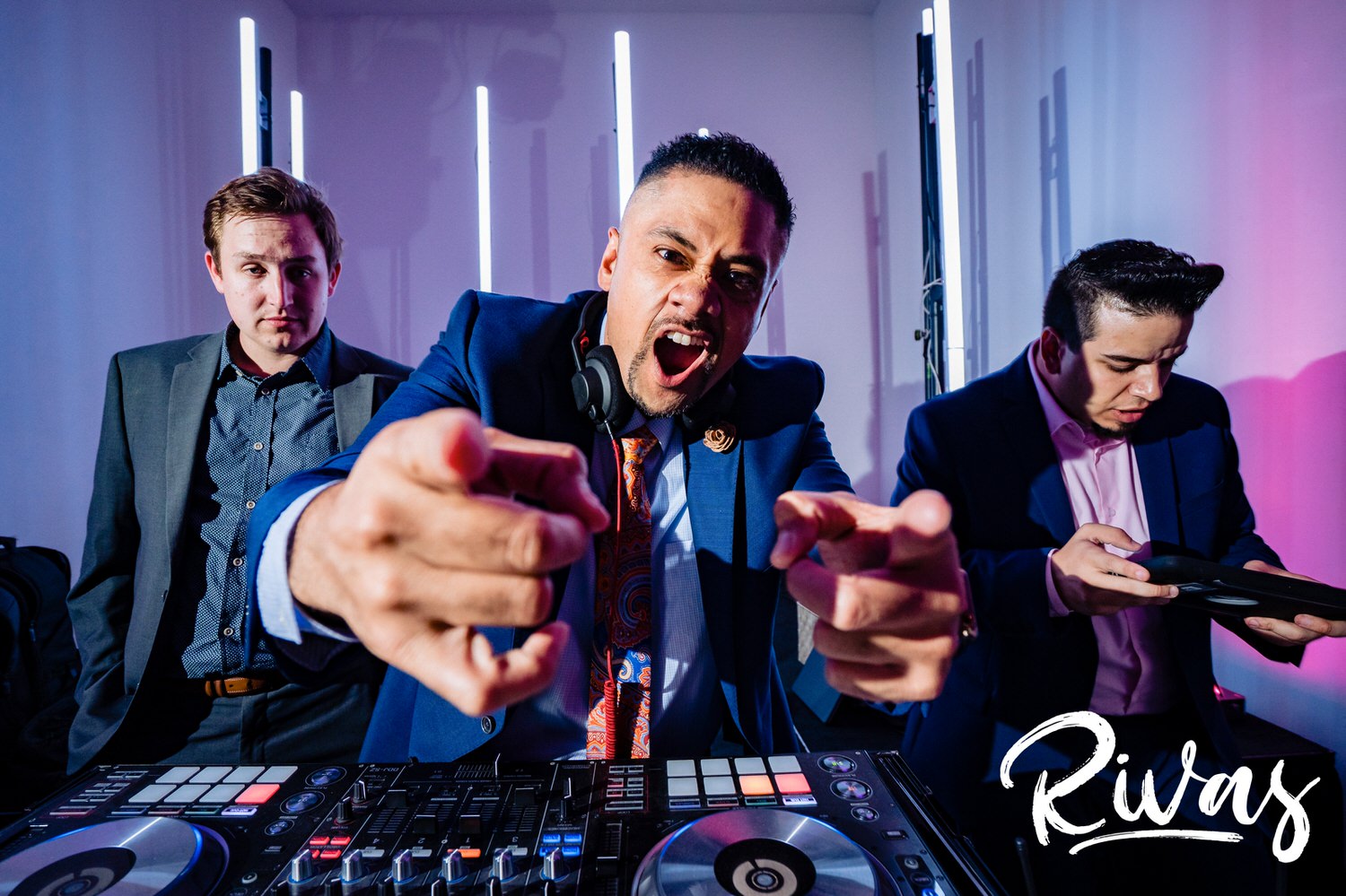 A candid picture of DJ Ray from Icon Events excitedly pointing at the camera during a wedding reception at The Gallery Event Space in downtown Kansas City. 