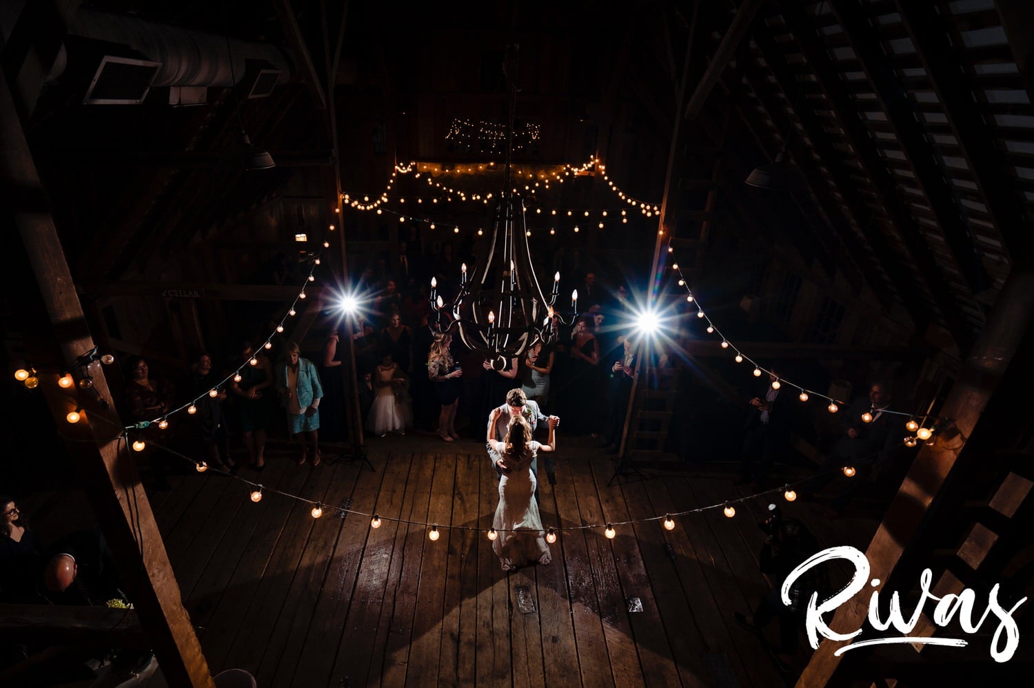 A colorful picture taken from above of a bride and groom sharing their first dance at their fall wedding reception at The Barns at Hamilton Station Vineyard. 