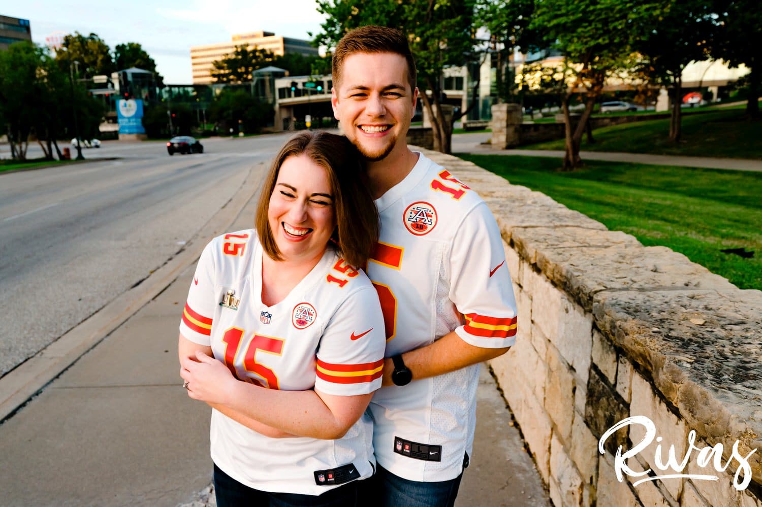 A colorful, fun picture of a couple in Chiefs Superbowl jerseys during their Chiefs Celebration Session in Kansas City. 