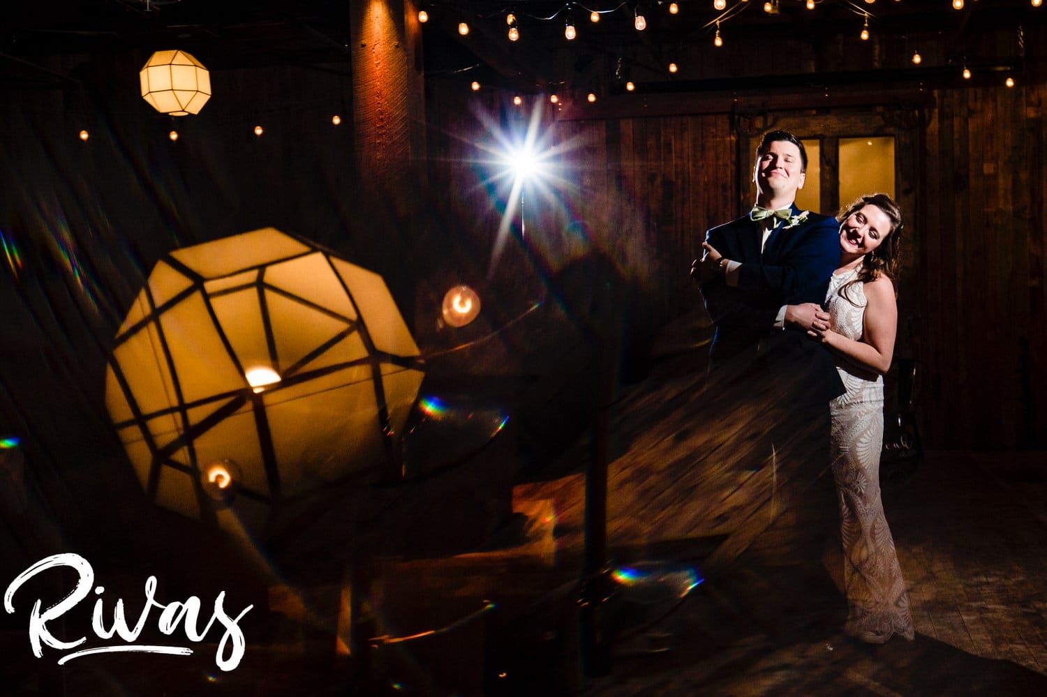 A candid colorful picture of a bride and groom sharing their first dance during their fall wedding reception at The Foundation Event Space in Kansas City. 
