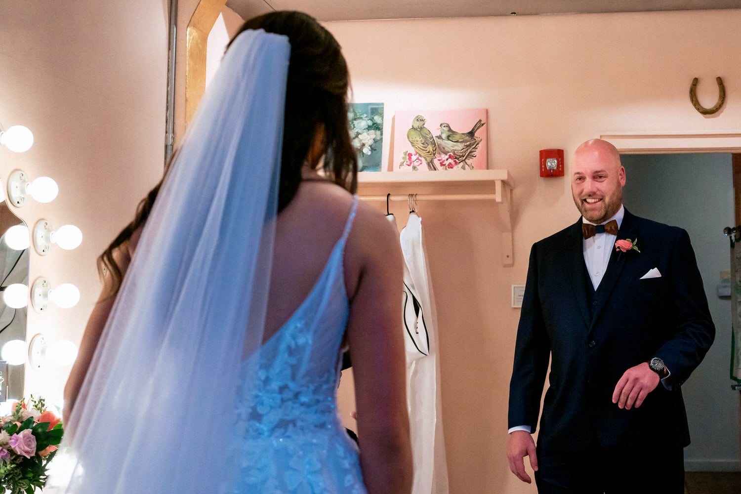A candid picture of a bride and groom's first look in the bridal suite at The Bride and The Bauer in Kansas City. 