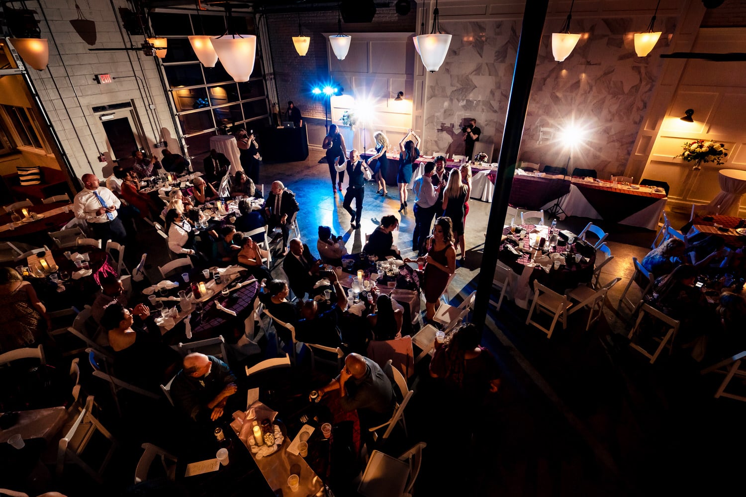 A wide picture taken from above of a wedding reception at The Station at 28 Event Space in Kansas City. 